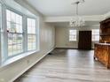 Bright dining room featuring hardwood floors and a bay window at 658 Brushwood Way, Greenwood, IN 46142