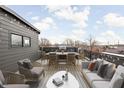 Spacious rooftop deck featuring a dining area, lounge seating, and city views at 1230 N Alabama St, Indianapolis, IN 46202