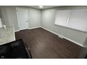 Simple dining area with dark hardwood floors and a window at 1801 W Morris St, Indianapolis, IN 46221