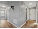 Bright hallway with laminate flooring and access to other rooms at 4204 Tarpon Bay Dr, Westfield, IN 46062