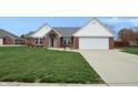 Brick ranch home with attached garage and landscaped yard at 4126 S Black Oak Ln, New Palestine, IN 46163