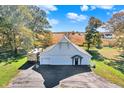 Large white barn with attached garage and RV parking at 691 S 1100 E, Zionsville, IN 46077