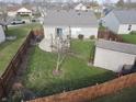 Large backyard with patio, shed, and fenced perimeter at 1039 Sunflower Ct, Franklin, IN 46131