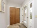 Bright entryway with tile floors and wood closet doors at 1189 N County Road 475 E, Avon, IN 46123