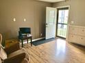 Small home office with hardwood floors and an exterior door at 2104 N Ball Ave, Muncie, IN 47304