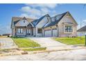 Stunning brick home with a three-car garage and landscaped yard at 16298 Grand Cypress Dr, Noblesville, IN 46060