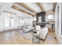 Bright and spacious living room with hardwood floors and a fireplace at 16298 Grand Cypress Dr, Noblesville, IN 46060