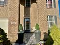 Inviting front entrance with decorative tile and potted plants at 2666 Creek Bank Ct, Columbus, IN 47201