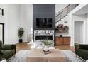 Living room featuring a statement fireplace and built-in shelving at 5187 Abington Way, Zionsville, IN 46077