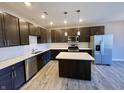 Modern kitchen with stainless steel appliances and an island at 2834 Maricopa Blvd, Whitestown, IN 46075