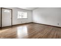 Spacious living room featuring hardwood floors and lots of natural light at 8016 Minlo Dr, Indianapolis, IN 46227