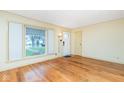 Bright living room featuring hardwood floors and large windows at 1110 N 15Th St, Noblesville, IN 46060