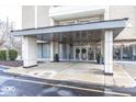 Modern building entrance with covered walkway and stylish design at 3965 N Meridian St # Apt 2A, Indianapolis, IN 46208