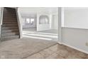 Bright living room with carpeted floor, high ceilings, and natural light at 8442 Burket Way, Camby, IN 46113