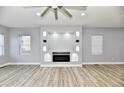 Bright living room featuring hardwood floors and a modern fireplace at 2318 E Brookside Ave, Indianapolis, IN 46218