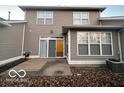 Small back patio with sliding glass doors leading to the interior at 581 Beehler Dr, Whiteland, IN 46184