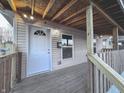 Inviting front porch with new flooring and wood railings at 424 S Oakland Ave, Indianapolis, IN 46201