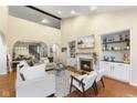 Spacious living room with fireplace, built-in shelves, and hardwood floors at 702 Chestnut Dr, Avon, IN 46123