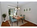 Bright dining room with wood floors and access to backyard at 105 Oakview Dr, Mooresville, IN 46158