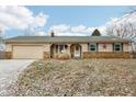 Ranch home with stone accents and a two-car garage at 12389 N Navajo Ct, Camby, IN 46113