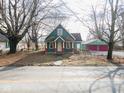 House with columns and red doors, situated on a tree-lined street at 15915 E 281St St, Atlanta, IN 46031