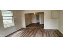 Bright living room with wood-look flooring and an open floor plan at 2914 Collier St, Indianapolis, IN 46241