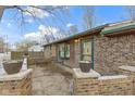 Brick patio with seating area, surrounded by brick planters at 621 E 111Th St, Carmel, IN 46280