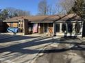 Brick ranch home with American flag, and large windows at 6522 W 13Th St, Indianapolis, IN 46214