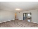 Open living room with view of updated kitchen at 3060 S Shortridge Rd, Indianapolis, IN 46239