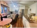 Bright kitchen with stainless steel appliances and hardwood floors at 4435 Blackstone Dr, Indianapolis, IN 46237