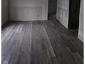 New gray vinyl flooring in a living room under construction at 1207 W 35Th St, Indianapolis, IN 46208