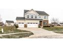 Two-story house with a brick and siding exterior, two-car garage, and landscaped lawn at 1862 Sterling Ct, Greenwood, IN 46143