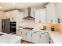 Spacious kitchen with white cabinets, stainless steel appliances, and quartz countertops at 20397 Hudson Bay Ln, Westfield, IN 46074