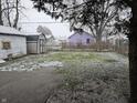 Large backyard with shed and snowy ground at 2814 Brown St, Anderson, IN 46016