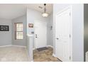 Bright entryway with tile flooring and coat closet at 661 White Ash Trl, Mooresville, IN 46158