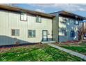 Updated townhouse exterior with a well-maintained lawn at 7909 Benjamin Dr, Indianapolis, IN 46226