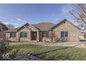 Brick ranch home with landscaped lawn at 9048 N Watson Meadows Ln, Mooresville, IN 46158