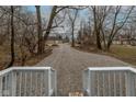 View from the back porch of a gravel driveway and neighboring houses at 2709 Station St, Indianapolis, IN 46218