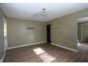 Living room with laminate wood floor and neutral walls at 3105 N Tacoma Ave, Indianapolis, IN 46218