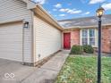 Brick and siding exterior with a red front door and walkway at 511 Woodberry Dr, Danville, IN 46122