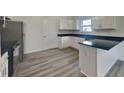 Modern kitchen with stainless steel appliances and island at 6110 Prairie Stream Way, Columbus, IN 47203