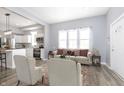 Open concept living room and kitchen with modern furnishings at 209 Trowbridge St, Indianapolis, IN 46201