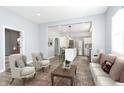 Open concept living room and kitchen with modern decor at 209 Trowbridge St, Indianapolis, IN 46201