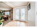 Bright entryway with double doors featuring decorative glass and hardwood floors at 432 500 N, Anderson, IN 46012