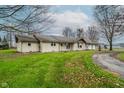 Charming ranch-style home with a large yard and attached garage at 432 500 N, Anderson, IN 46012
