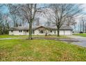 Single story home with attached garage and circular driveway at 432 500 N, Anderson, IN 46012