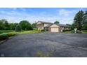 Exterior view of the home, driveway, and attached garage at 4832 E 200 N, Anderson, IN 46012
