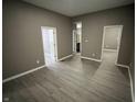 Open living area with gray walls and wood-look flooring at 416 N Mulberry St, Muncie, IN 47305