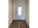 Bright entryway with a frosted glass front door and wood-look flooring at 564 Cowley Dr, Westfield, IN 46074