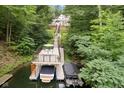 Private dock with boat lift and slips, perfect for water activities at 7701 Center Lake Rd, Nineveh, IN 46164